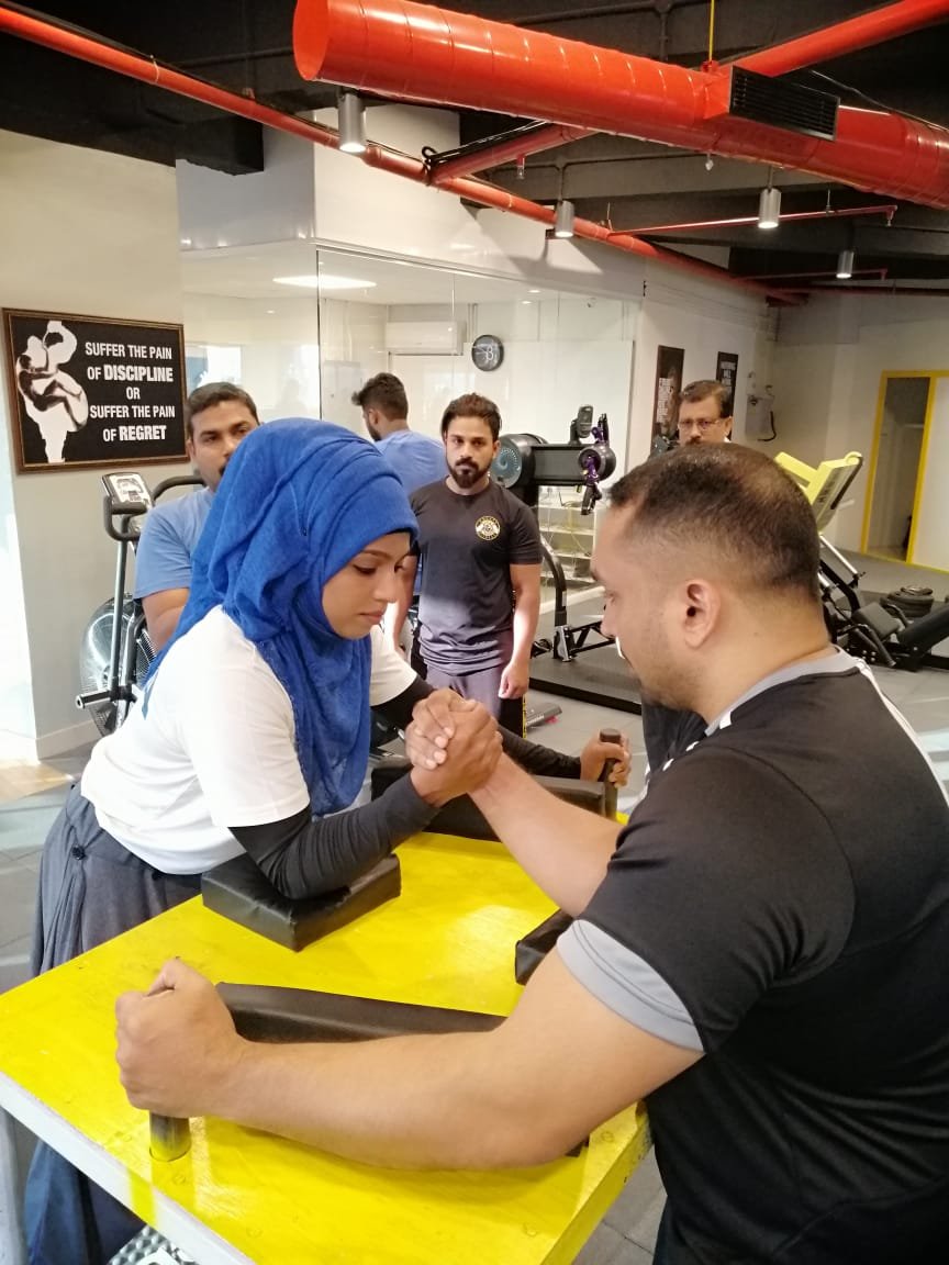Majiziya Bhanu with her ARM wrestling coach Saleesh EV from Popeye fitness centre calicut