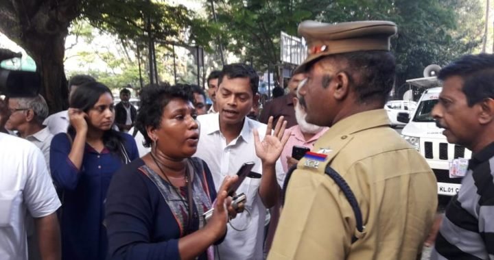 Bindu Ammini, rights activist, arguing with police outside the City Police Commissioner's Office in Kochi on Tuesday morning.