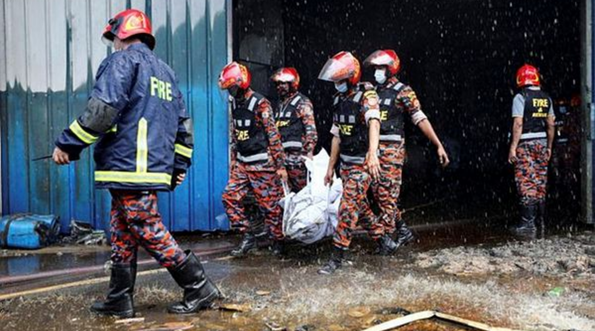 Rescue workers carry the bodies that were recovered after a fire broke out at a factory of Hashem Foods Ltd in Rupganj, Narayanganj district, on the outskirts of Dhaka, Bangladesh, July 9, 2021.