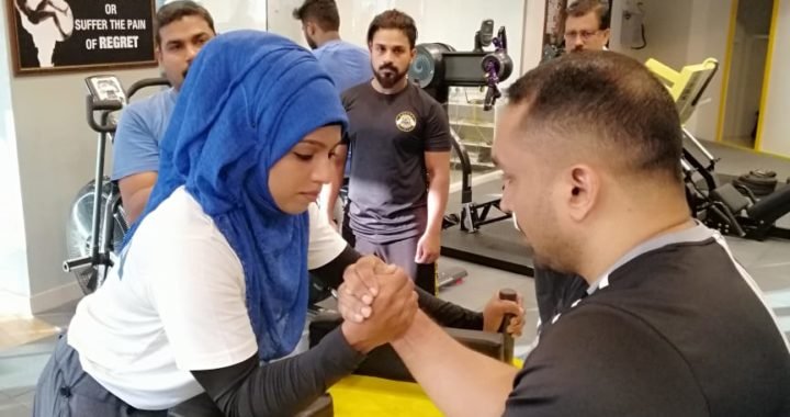 Majiziya Bhanu with her ARM wrestling coach Saleesh EV from Popeye fitness centre calicut