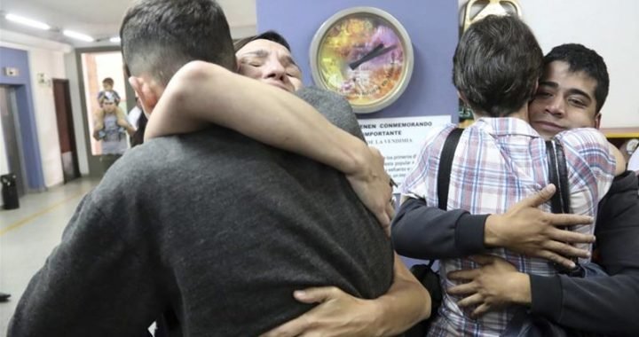 Victims and relatives from the Antonio Provolo Institute for Deaf and Hearing Impaired Children embrace after hearing a guilty verdict for their abusers.