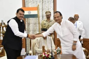 Maharashtra CM Devendra Fadnavis shaking hands with Nationalist Congress Party (NCP) leader Ajit Pawar after the oath-taking ceremony.