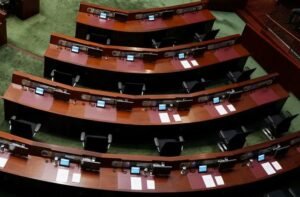 FILE PHOTO: Empty seats of pro-democracy lawmakers are seen during Hong Kong Chief Executive Carrie Lam's annual policy address at the Legislative Council in Hong Kong, China November 25, 2020.