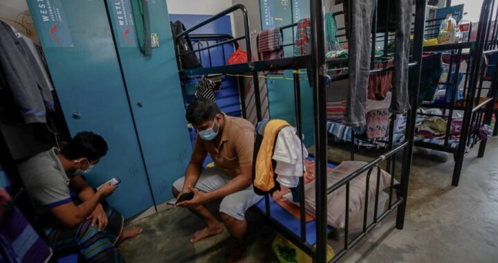 Migrant workers in their room in the Westlite Juniper dormitory in Singapore in August of last year.